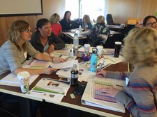 Kindergarten teachers engaged in advanced Early Year Evaluation training.